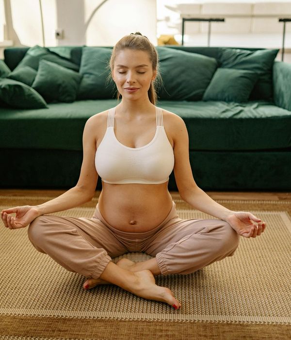 Woman performing gentle eye exercises in a calm room environment.